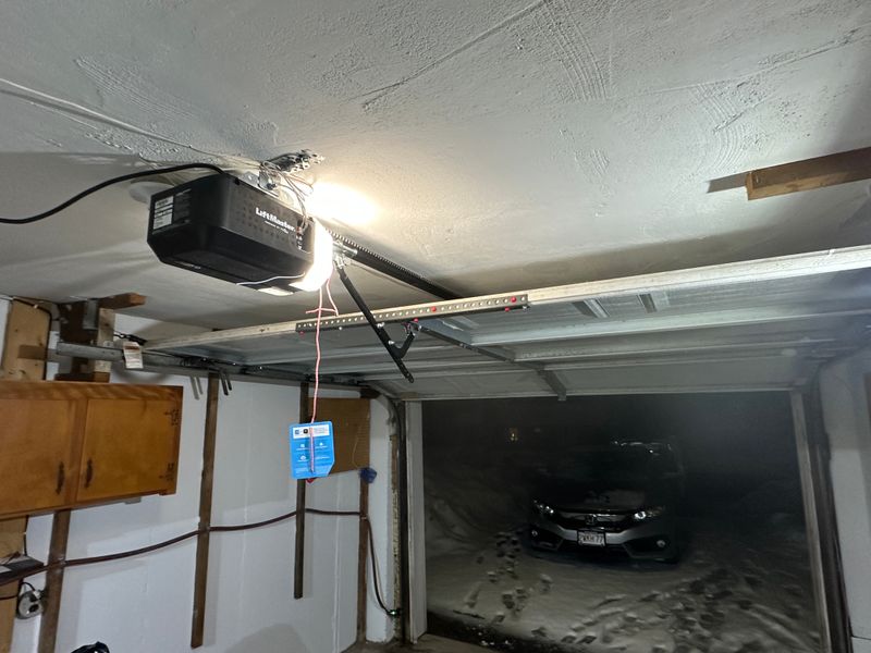 LiftMaster opener installed in residential garage with MyQ device — Massachusetts winter